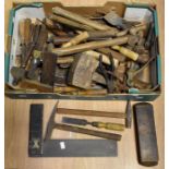 A collection of vintage tools including planes, saws, spanners, hammers, chisels, wooden Stanley and