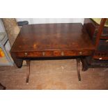 A Regency style walnut veneered sofa table, fitted with two drawers, measuring 69cm high, 95cm wide,