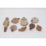 A collection of antiquities including an Egyptian deity, Roman oil lamp, perfume bottle etc