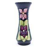 Moorcroft Pottery: A Moorcroft 'Violet' pattern vase designed by Sally Tuffin. Height approx 13cm.