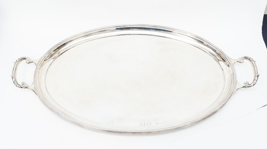 A George VI silver two handled oval plain tray, reeded raised rim, by Mappin & Webb, Sheffield,