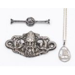 A collection of viking themed jewellery to include a silver bar brooch with Viking boat detail, a