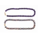 An amethyst bead necklace comprising round faceted beads measuring approx 10mm, length approx 60.