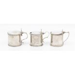 A collection of three large drum shaped mustard pot and covers: to include George III large silver