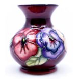 Moorcroft Pottery: A Moorcroft 'Pansy' pattern vase designed by Rachel Bishop. Height approx 9.