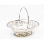 A George IV small recticulated silver bright cut engraved oval basket with swing handle, beaded rim,