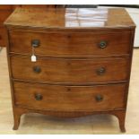 An early 19th Century mahogany chest of drawers, bow fronted form, comprising three drawers each