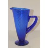 A late 20th Century blue glass jug, studio made, polished pontil mark to underside, 26cm high
