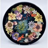 Moorcroft Pottery: A Moorcroft numbered edition 'Carousel' charger designed by Rachel Bishop.