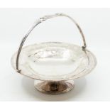 A George V silver circular fruit bowl, with ribbon-tied reeded border, the body chased with ribbon