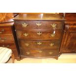 A George III oak chest of four drawers, brass handles, on bracket feet