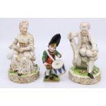 A Derby figure, Drummer Boy approx 14cm high; and a pair of Continental Meissen style figures of a