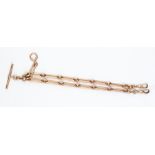 A 9ct rose gold lozenge link watch chain, double swivel clasps, T bar, total length approx 14",