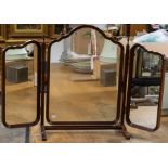 A 20th Century mahogany framed folding tri compartmented dressing table mirror, central support on