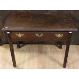 A George III oak side table, circa 1770, fitted with a single drawer, raised on square legs, 66cm