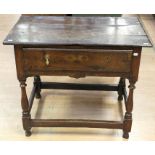 A George I joined oak side table, circa 1720, fitted with a single drawer, raised on turned supports