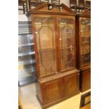 A pair of George III style mahogany bookcases, in the manner of Thomas Chippendale, each bookcase