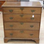 A George III oak chest of drawers, circa 1800, comprising four drawers, retaining original locks,
