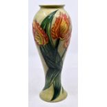 Moorcroft Pottery: A Moorcroft Collectors Club 'Tulip' pattern vase. Height approx 27.5cm. Impressed