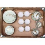 A 1920's egg shell Japanese tea set, egg shell green with crocus flowers