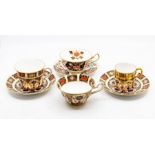 A Royal Crown Derby 1128 pattern breakfast cup and saucer (1st); an 1128 teacup and saucer (cup 2nd,