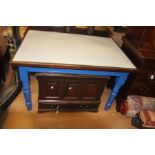 A 20th Century kitchen table, Formica top, raised on turned supports, painted blue frame,