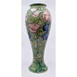 Moorcroft Pottery: A Moorcroft Collectors Club 'Sweet Pea' baluster vase designed by Sally Tuffin.