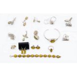 A collection of silver and white metal yellow amber set jewellery to include a bracelet, a bangle, a