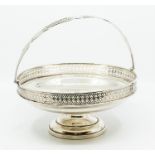 A George V silver large circular fruit basket, swing handle the body with reticulated upper gallery