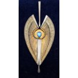A contemporary silver and 18ct gold pendant/artwork set with a pear shaped dichroic glass cabochon