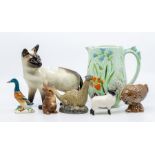 Collection of Beswick figures including Siamese cat, sheep, rabbit, duck, along with a water jug,