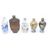 Five various scent bottles, comprising two cloisonne examples, two ceramic and a further carved