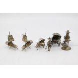 A collection of small Asian white metal figures to include:  a pair of Chinese Boats Chinese