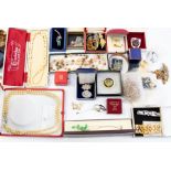 A collection of costume jewellery to include a silver pendant, gilt metal bangle faux pearls,