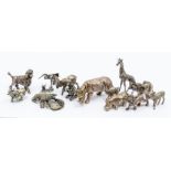 A sterling silver stamped 925 model of a Rhinosaurus together with a large group of 800 standard