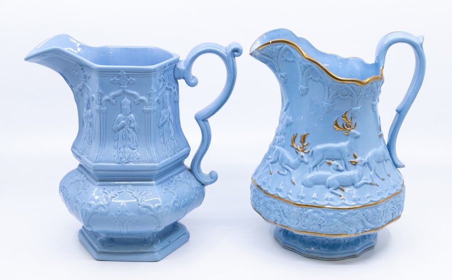 A group of early nineteenth century blue stoneware relief moulded jugs, c.1830-50. To include: a