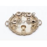 A 925 sterling silver circular miniature two handled tray together with a miniature white metal