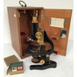 Early to mid 20th Century cased microscope with accessories, slides, Ernst Leitz Wetzlar