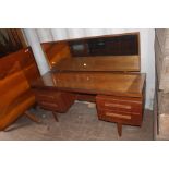 A G-Plan teak dressing table, designed by Victor Wilkins in the 1960s, mirrored backed, suspended