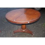 A William IV mahogany breakfast table, raised on a platform base, measuring 73cm high, 107cm in