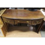 An Edwardian mahogany dressing table, bow fronted, fitted with single drawer to centre and side