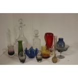 A box of assorted glassware, comprising a claret jug, a whisky decanter, various studio glass vases,
