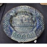 A studio pottery charger, blue glaze with stylised birds and flower decoration. JW monogram and 79