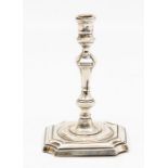 A Victorian silver chamber stick, tapering stem with knop on shaped square base, spool shaped