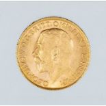 A 1911 George V gold sovereign, London mint.