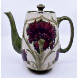 Moorcroft: A William Moorcroft 'Revived Cornflower' pattern coffee pot. Unusual mauve colourway.