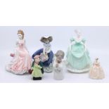 A Royal Doulton figure Sairy Gamp; three Coalport ladies including a miniature lady; two Lladro