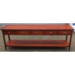 A contemporary hardwood hand crafted serving table, fitted with five drawers, measuring 75cm high,