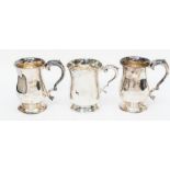 An Elizabeth II plain silver mug, with scroll handle acanthus thumbpiece, engraved with monogram, by