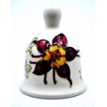 Moorcroft Pottery: A Moorcroft 'Columbine' pattern bell. Height approx 11cm. Painted WM mark to